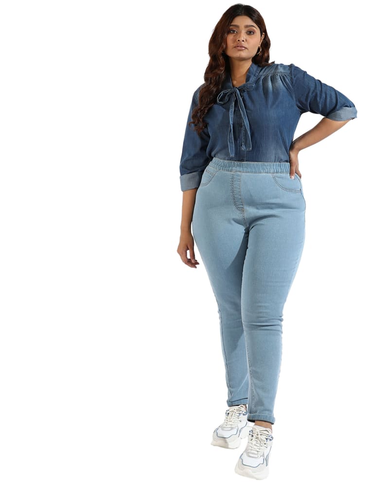 Front of a model wearing a size 36 Confirtable Fitted Jeans in Light Blue by Instafab Plus. | dia_product_style_image_id:297638